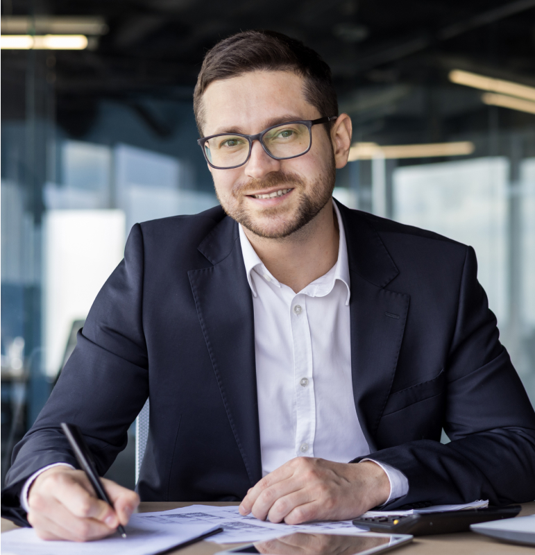 Man in suit writing documents