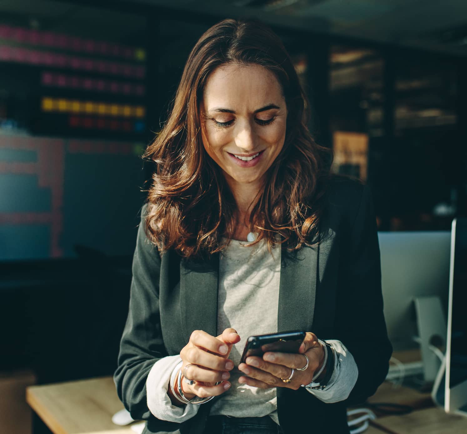 Woman_Looking_Down_at_Phone